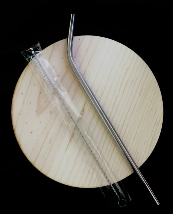 A metal straw and straw cleaner brush